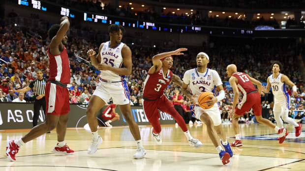 Mar 18, 2023; Des Moines, IA, USA; Kansas Jayhawks guard Dajuan Harris Jr. (3) drives to the basket against Arkansas Razorbacks guard Nick Smith Jr. (3) during the second half at Wells Fargo Arena.